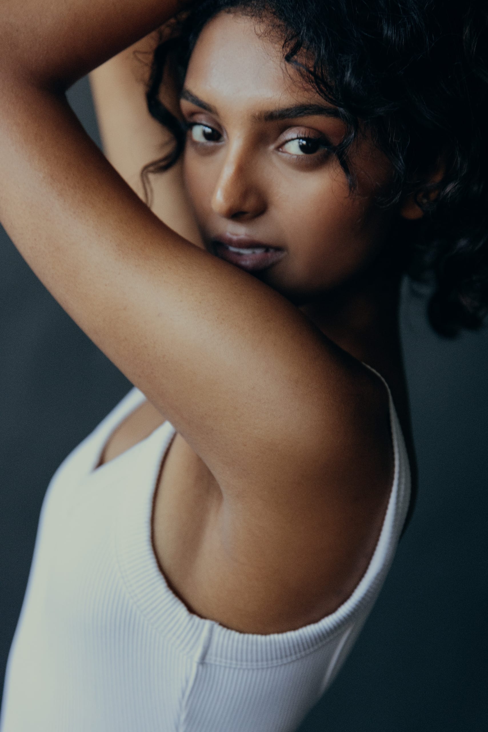 Digital — close portrait, neutral expression, grey studio wall