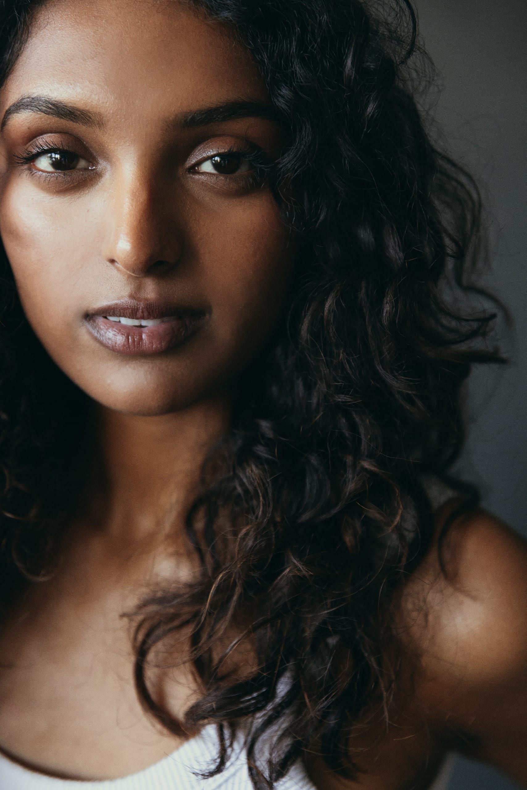 Digital — close portrait, no product, grey studio wall